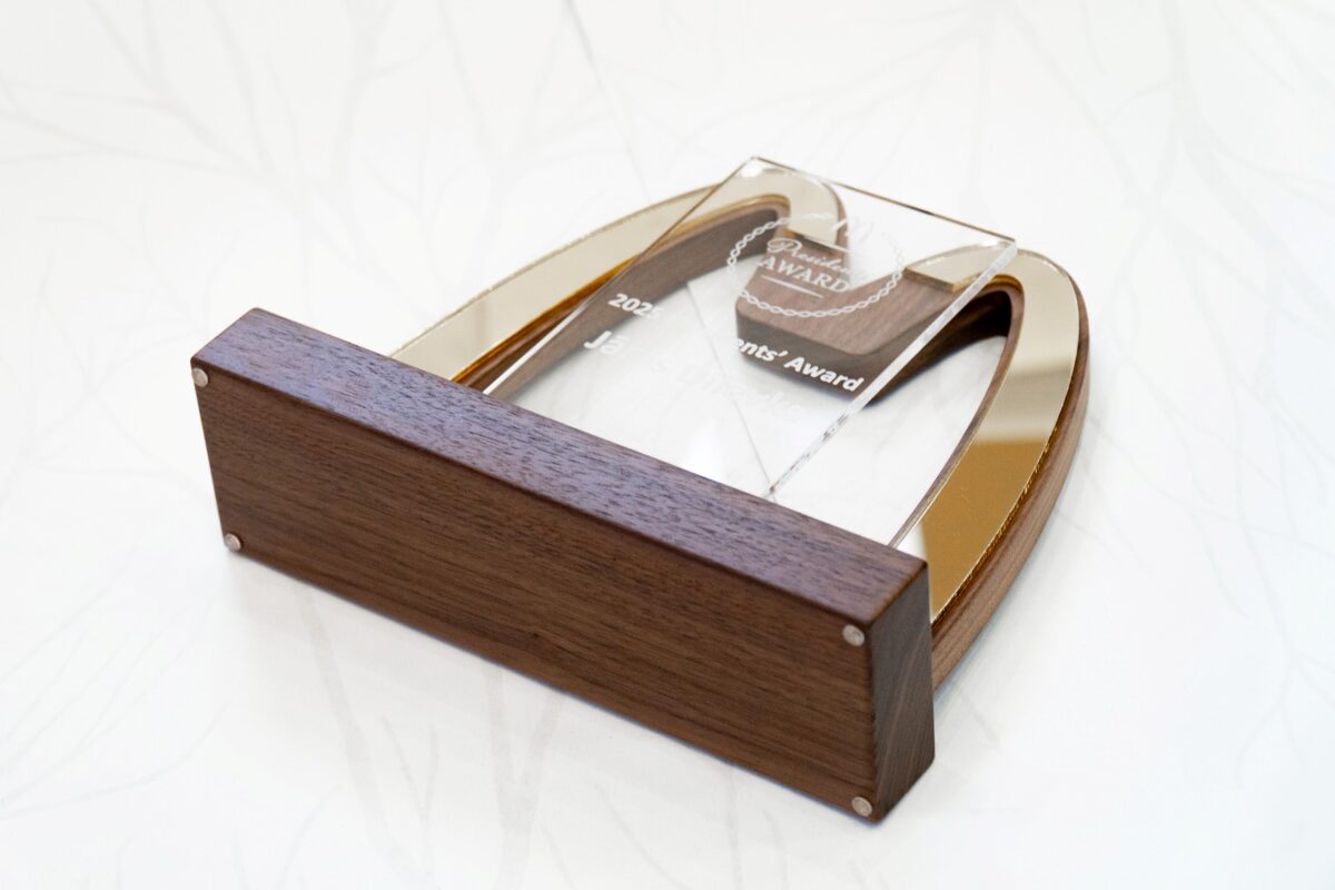 detailed profile view of wood and gold award